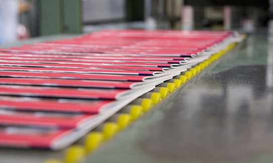 Printed booklets on a conveyer