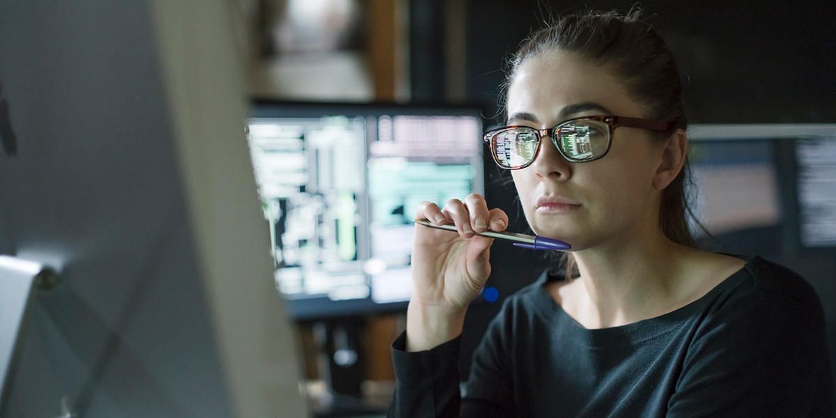 Woman working at a computer.