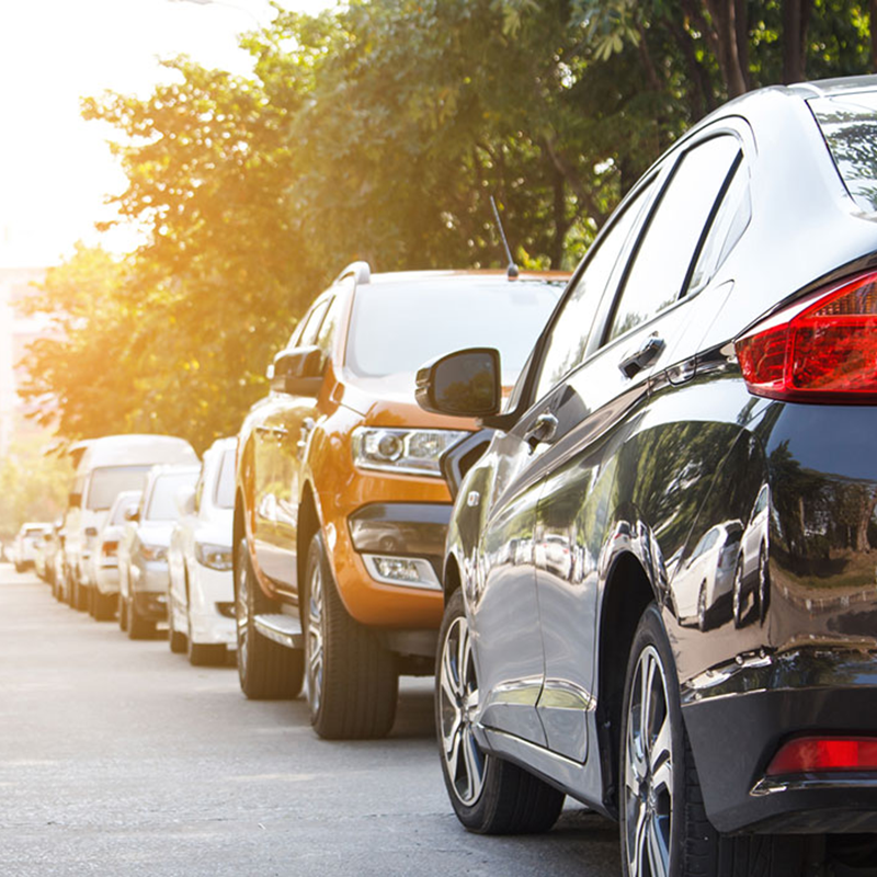 Cars parked alongside a road