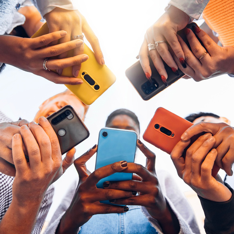 Group of people using their phones