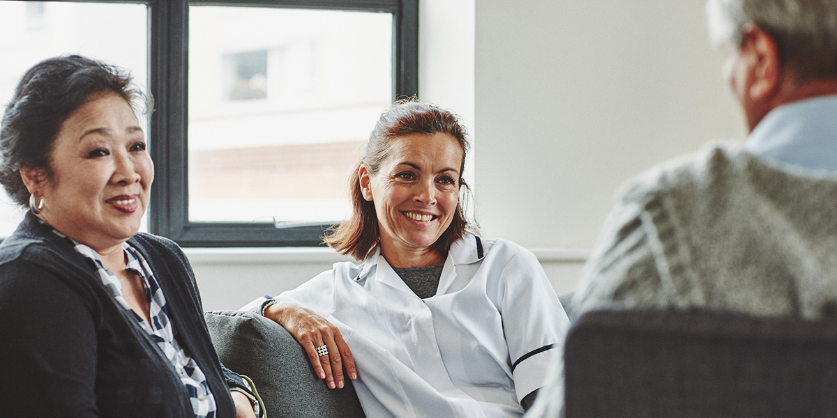 A care worker consulting a couple.