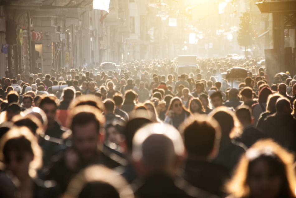 Crowd walking down a street