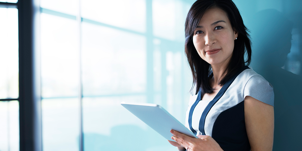 Woman holding an iPad device